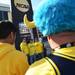 Michigan alumni Ryan Anderson, of Lansing, Matt Burrows, of Ann Arbor and Michael Ball, of Ann Arbor, have their photo taken in front of a giant NCAA trophy outside of the Georgia Dome before the start of the Final Four in Atlanta on Saturday, April 6, 2013. Melanie Maxwell I AnnArbor.com